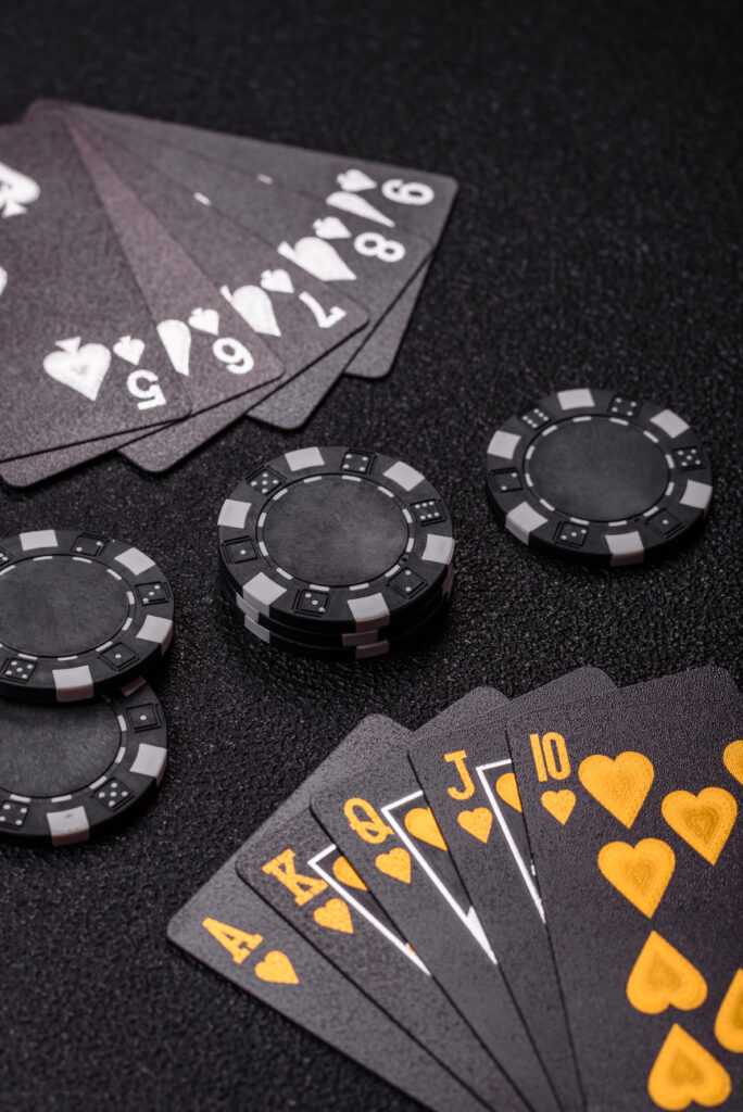 Playing card game poker in casino with chips, bets and risk. Cards and chips