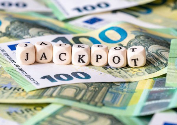 Jackpot letter cubes on euro banknotes Jackpot letter cubes on euro banknotes