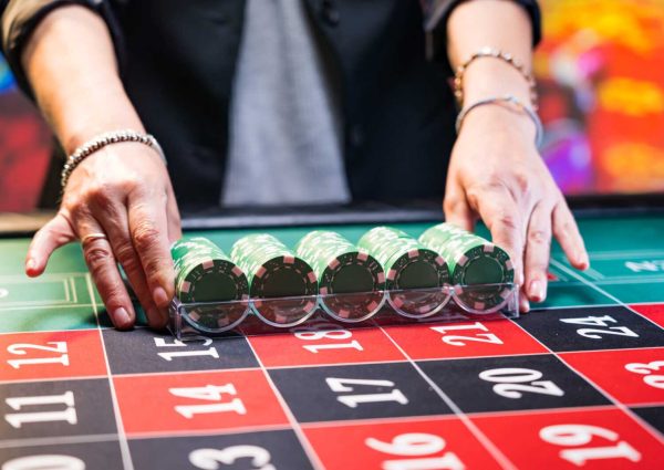 Woman playing roulette at the casino